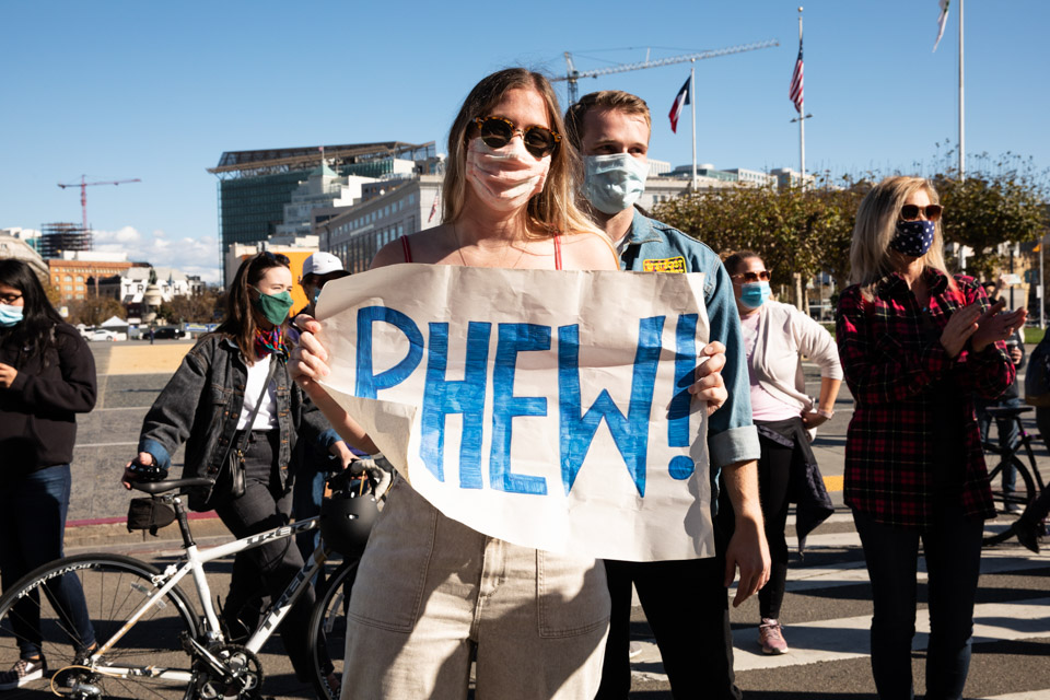 A sign at held at the City Hall celebration expresses relief.