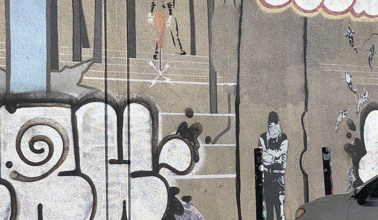 Banksy mural in the Mission marked up by taggers