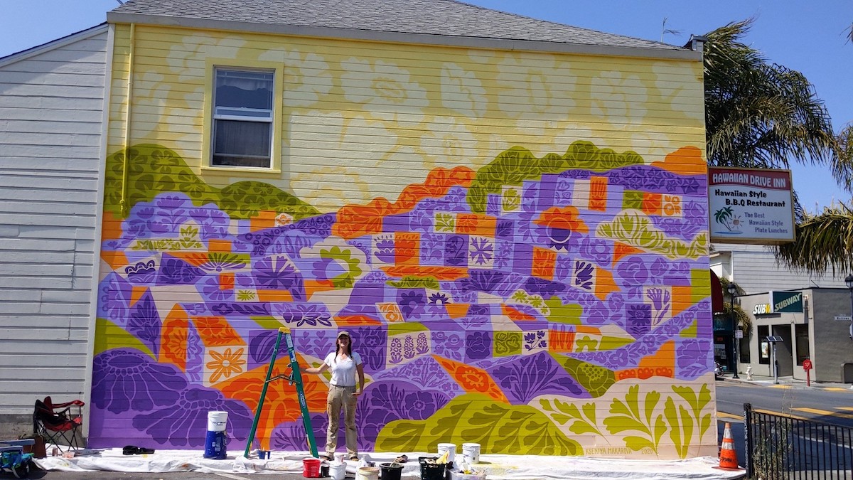 Kseniya Makarova stands in front of the completed "Portola Blossoms" | Photo: Portola Neighborhood Association