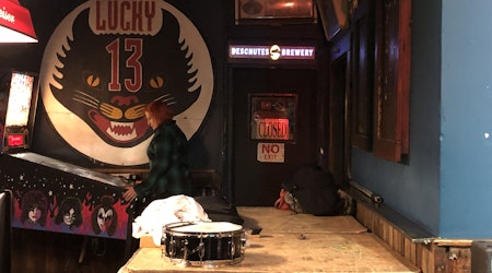 The Lucky 13 Sign has a new home, inside Bender’s Bar & Grill