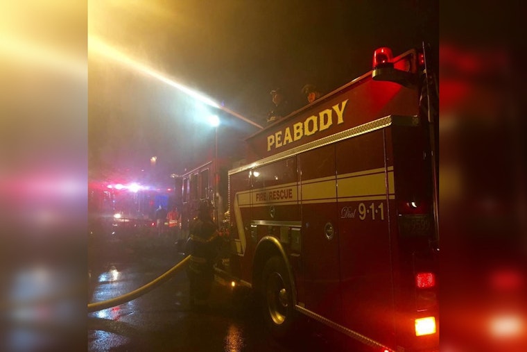 Firefighters Battle Intense Blaze and Gusty Winds at Historic Peabody House Engulfed in Flames