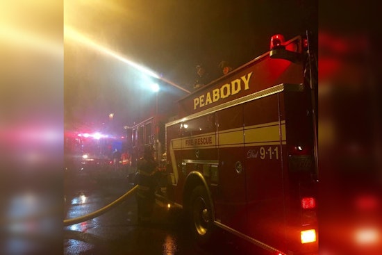 Firefighters Battle Intense Blaze and Gusty Winds at Historic Peabody House Engulfed in Flames