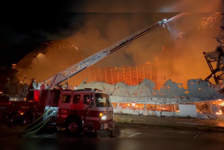 Historic WWII-Era Hangar Goes Up in Flames as Orange County Fire Crews Struggle with Water Accessibility
