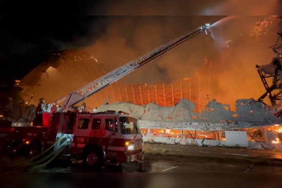 Historic WWII-Era Hangar Goes Up in Flames as Orange County Fire Crews Struggle with Water Accessibility