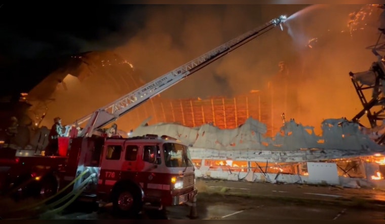 Historic WWII-Era Hangar Goes Up in Flames as Orange County Fire Crews Struggle with Water Accessibility