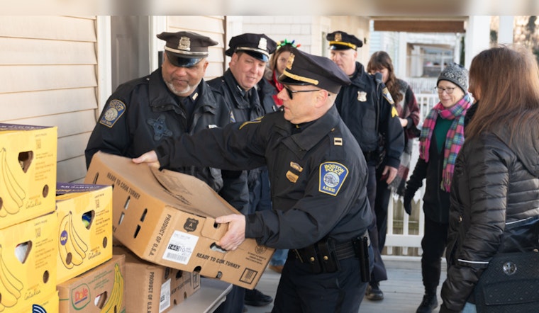 Boston Police Captain and Officers Partner with Local Businesses to Deliver Turkey Dinners to Families in Need
