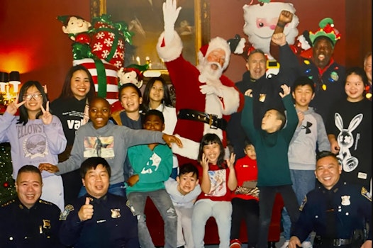 Boston Police Swap Badges for Santa Hats at Harvard Club's Festive Family Christmas Party