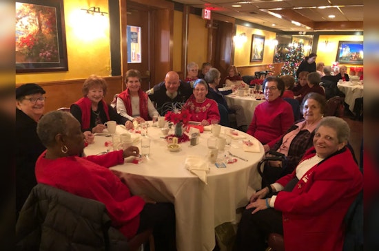 Boston's Finest Don Santa Caps as Boys in Blue Bring Holiday Cheer to Seniors