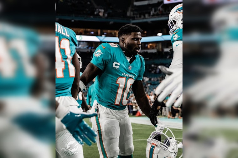 Miami Dolphins' Tyreek Hill Fires Back at Analyst Colin Cowherd's Playoffs Jab Amidst Strong Season