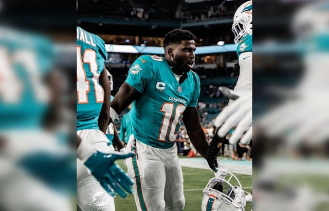 Miami Dolphins' Tyreek Hill Fires Back at Analyst Colin Cowherd's Playoffs Jab Amidst Strong Season