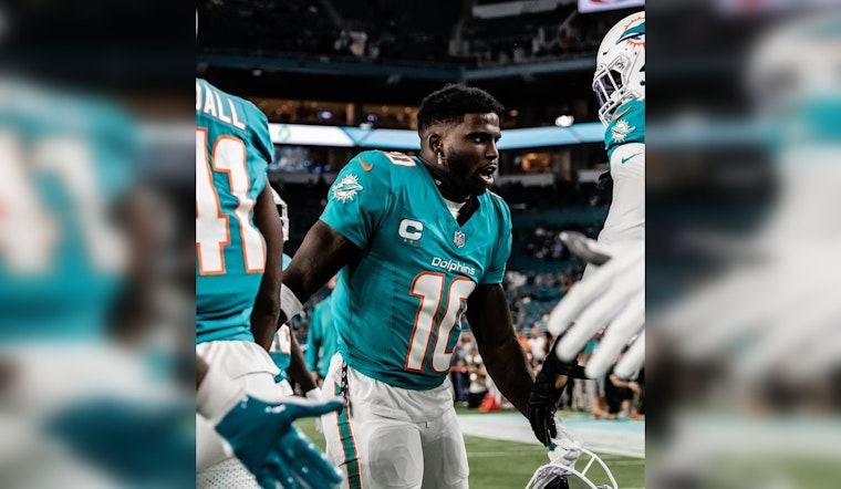 Miami Dolphins' Tyreek Hill Fires Back at Analyst Colin Cowherd's Playoffs Jab Amidst Strong Season