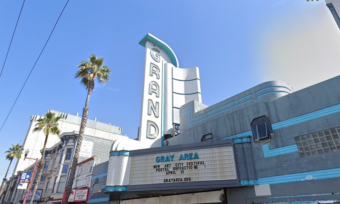 Neon sign for Mission Street's Grand Theater lights up for the first time in decades