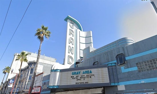 Neon sign for Mission Street's Grand Theater lights up for the first time in decades