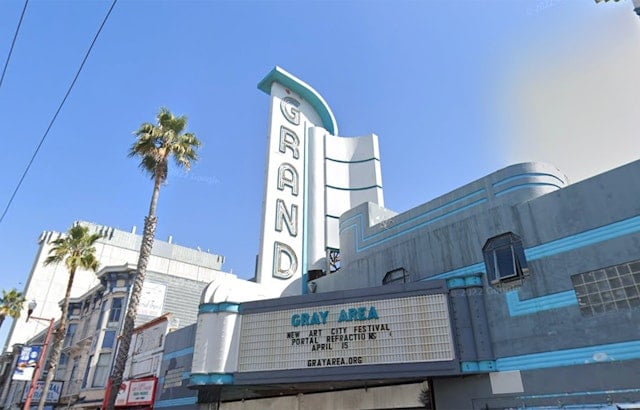 Neon sign for Mission Street's Grand Theater lights up for the first time in decades