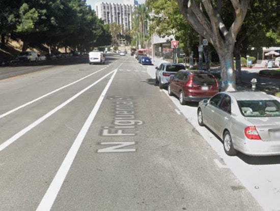 Woman Shot in Car in Downtown LA, LAPD Seeks Public's Aid to Identify Moped-Riding Suspect