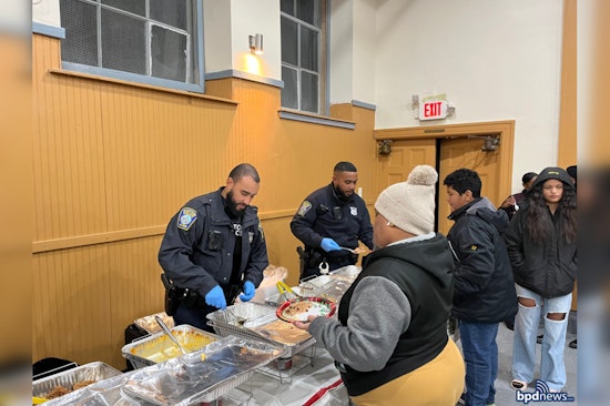 Boston Police Officers Serve Up Cheer at Ella J. Baker House Christmas Party