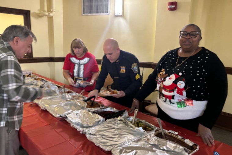 East Boston Police Bring Holiday Cheer to Seniors at Barnes School Apartments
