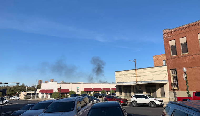 Firefighters Tackle Major Blaze in East Denton, Smoke Visible from the Square