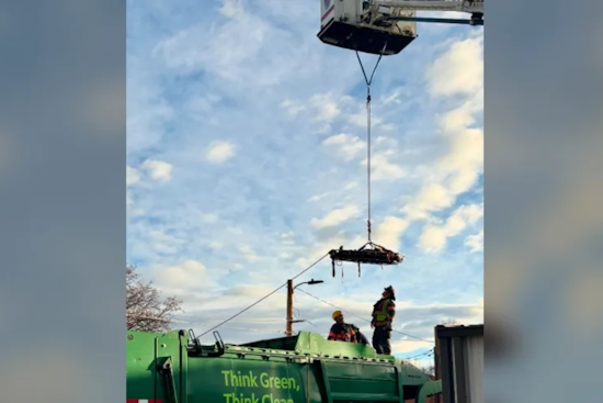 First Responders Conduct Dramatic Rescue of Injured Person from Top of Trash Truck in Downtown Loveland