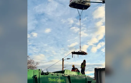 First Responders Conduct Dramatic Rescue of Injured Person from Top of Trash Truck in Downtown Loveland