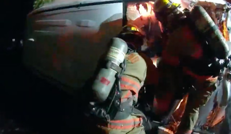 Heroic Rescue in Southeast Portland: Firefighters Save Woman from Burning Car After Crash