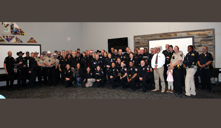 Lewisville Police Officers Bring Holiday Joy in "Shop with a Cop" Event with Local Children