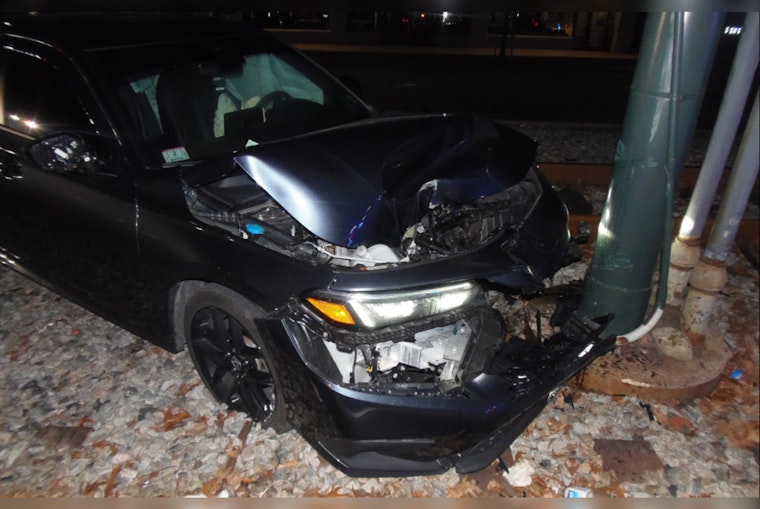 Driver Flees After Crashing Car onto MBTA Tracks in Boston, Causing Commuter Delays