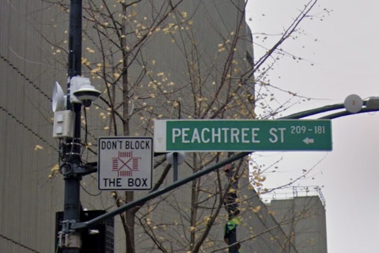 Massive Sinkhole Swallows Sign, Sidewalk on Peachtree Street in Buckhead, Impacting Traffic and Businesses
