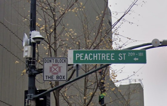 Massive Sinkhole Swallows Sign, Sidewalk on Peachtree Street in Buckhead, Impacting Traffic and Businesses