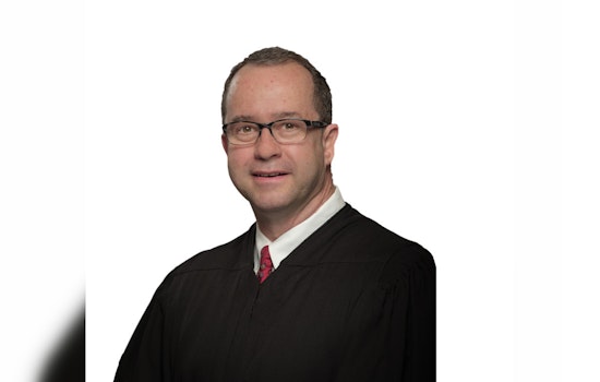 Texas Supreme Court Justice John Devine Under Scrutiny for Not Recusing in Controversial Sex Abuse Case Linked to Former Firm
