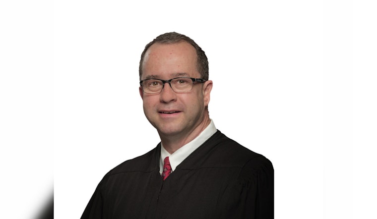 Texas Supreme Court Justice John Devine Under Scrutiny for Not Recusing in Controversial Sex Abuse Case Linked to Former Firm