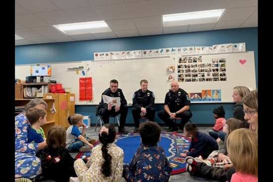 Mankato Police Officers Trade Patrolling for Pages During "I Love to Read" Month