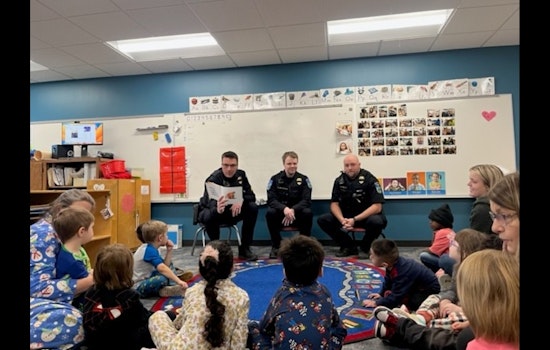Mankato Police Officers Trade Patrolling for Pages During "I Love to Read" Month