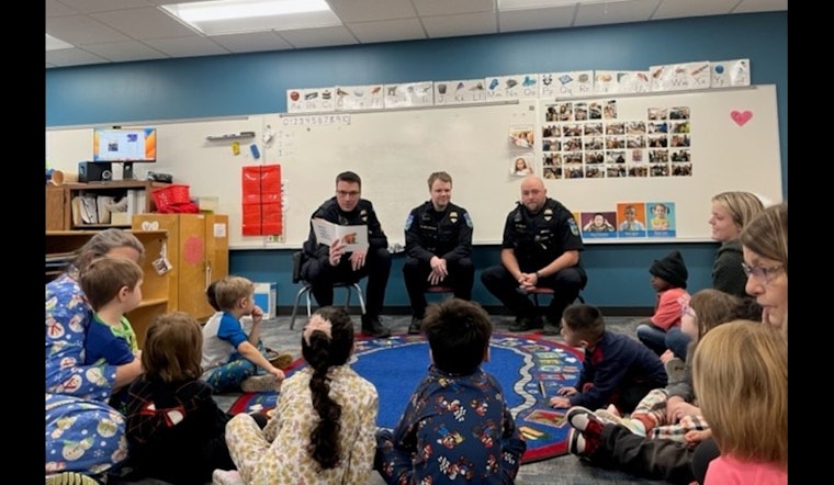 Mankato Police Officers Trade Patrolling for Pages During "I Love to Read" Month