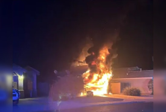 Surprise Home Engulfed in Flames, Firefighters Deploy Cutting-edge Tactic on Hybrid Vehicle Fire