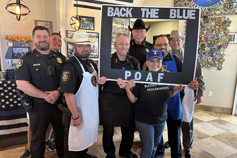 Local Law Enforcement Swaps Handcuffs for Aprons at "Dining for Heroes" Event to Support Fallen Officers' Foundation