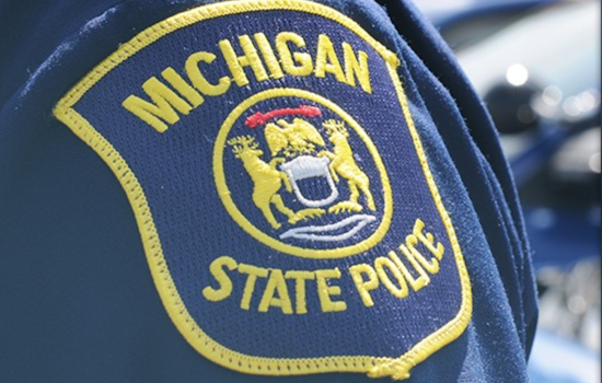Michigan State Trooper Sustains Minor Injuries in Collision with Tesla SUV in Monroe County