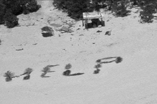 Stranded Sailors Spell "HELP" with Palm Leaves, Prompting Rescue from Pikelot Atoll by U.S. Coast Guard