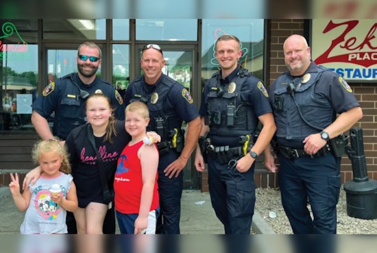 Bloomington Police Swap Handcuffs for Scoops in Community-Building 'Cops and Cones' Summer Event