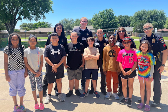 Carrollton Police Officers Bond with Youth at Local Field Day Event