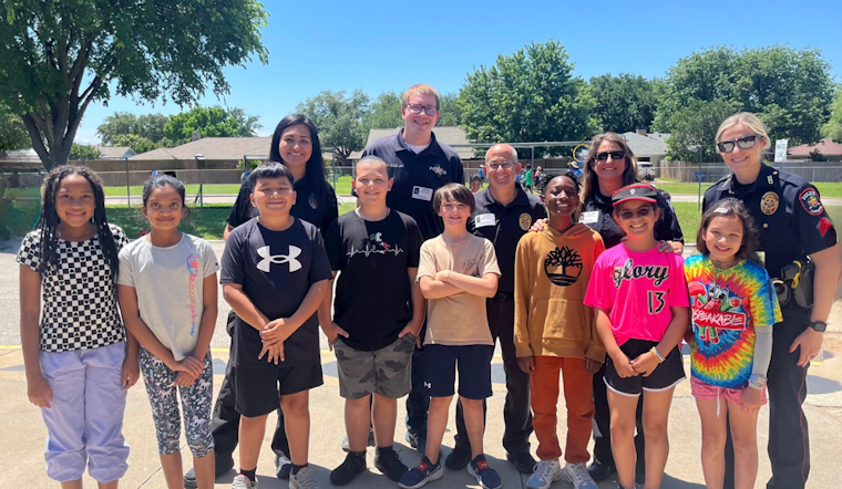 Carrollton Police Officers Bond with Youth at Local Field Day Event