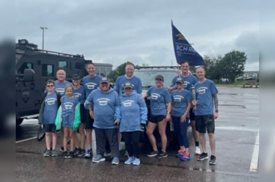 Eden Prairie Police Run Through Rain for Special Olympics Torch Relay