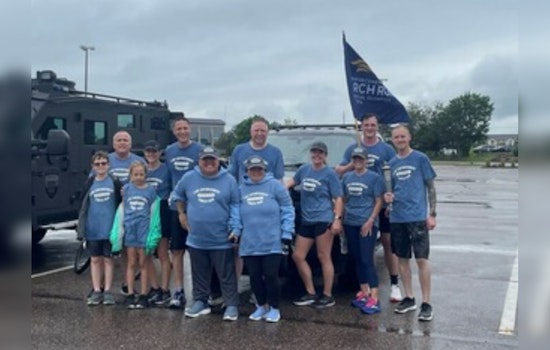 Eden Prairie Police Run Through Rain for Special Olympics Torch Relay