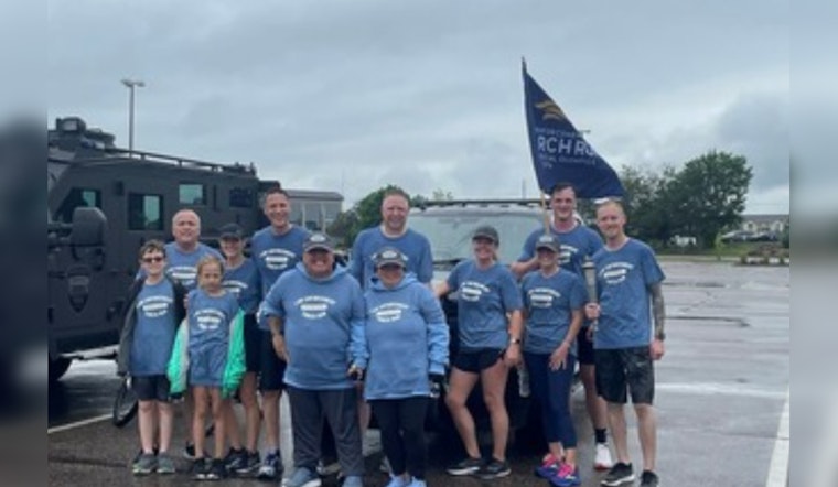 Eden Prairie Police Run Through Rain for Special Olympics Torch Relay