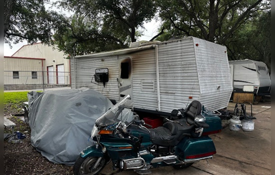 Houston Community Mourns as Fire Claims Life in Travel Trailer Blaze, Arson Investigation Underway