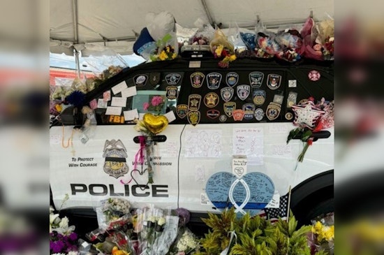 Minneapolis Community Honors Fallen Officer Jamal Mitchell with Growing Memorial at Fifth Precinct