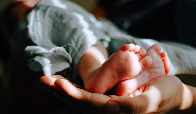 Newborn Found Next to Donation Box in Houston; Mother Hospitalized, Investigation Underway