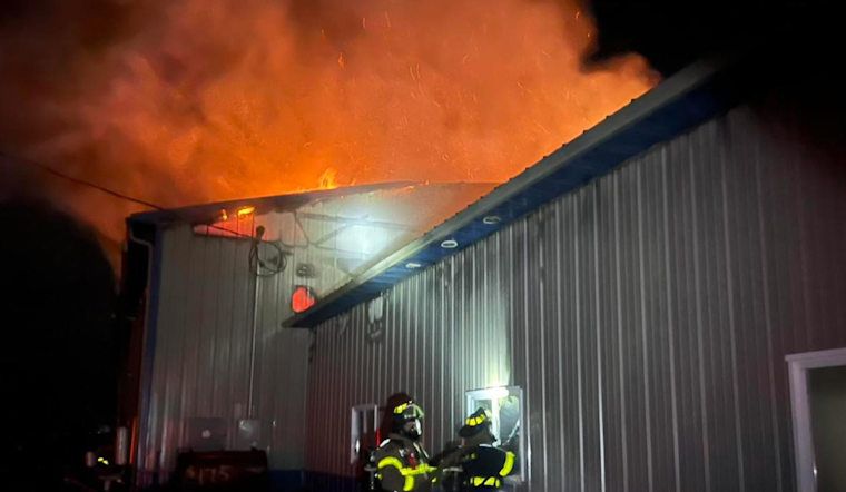Sheridan Auto Repair Shop Engulfed in Flames, Community Effort Extinguishes Blaze with No Injuries Reported