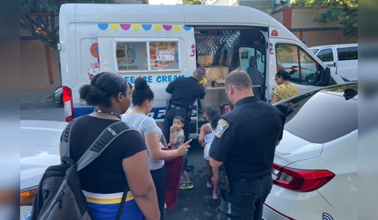 Boston Police Light Up Roslindale with Hot Dog Night and Community Flashlight Walk