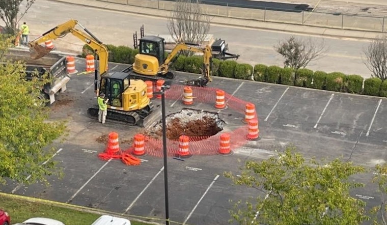 Construction Truck Reveals Historic Cistern After Sinking Into Clarksville City Hall Parking Lot Sinkhole